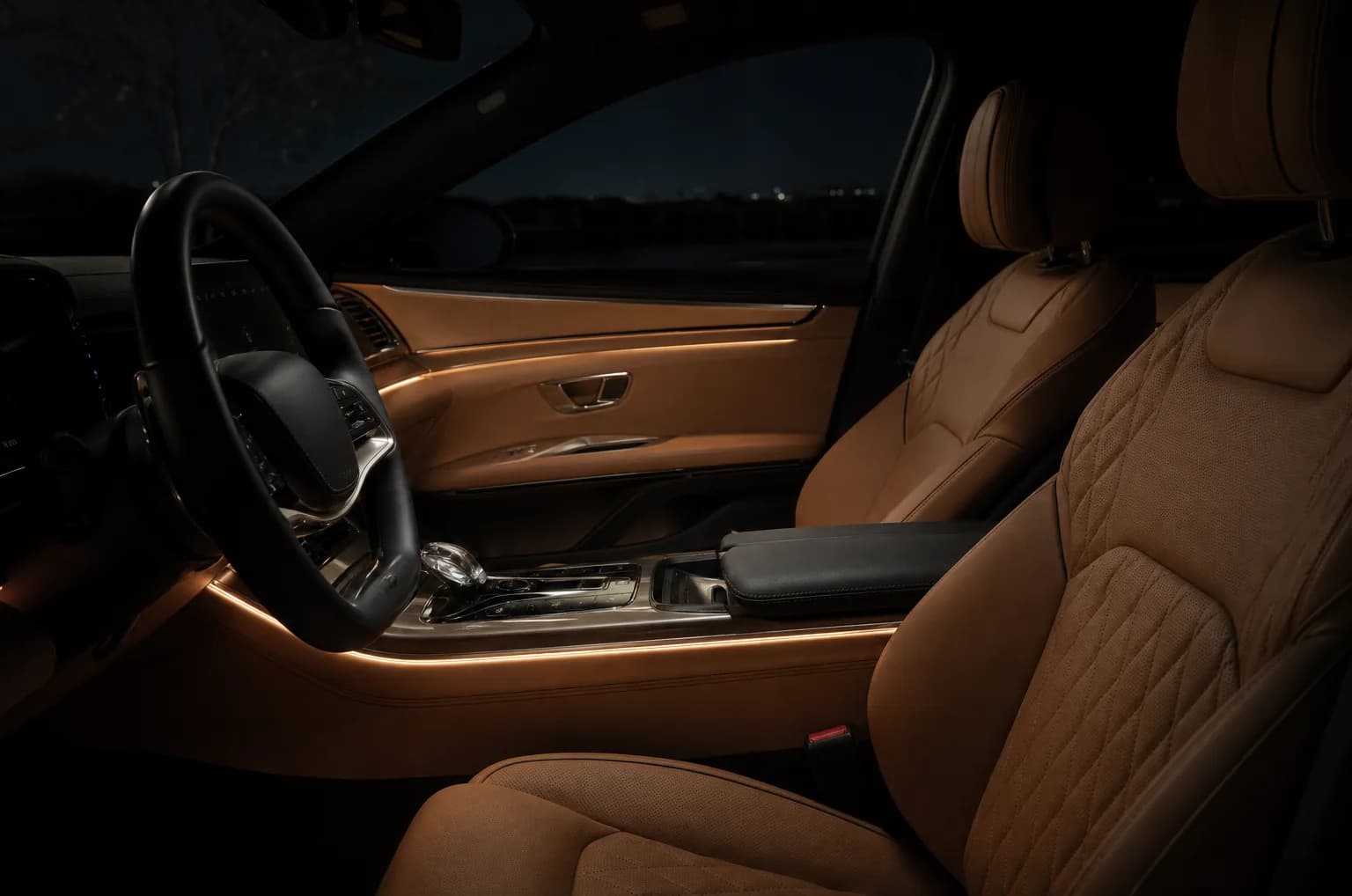 Empty car cabin lit by soft interior light